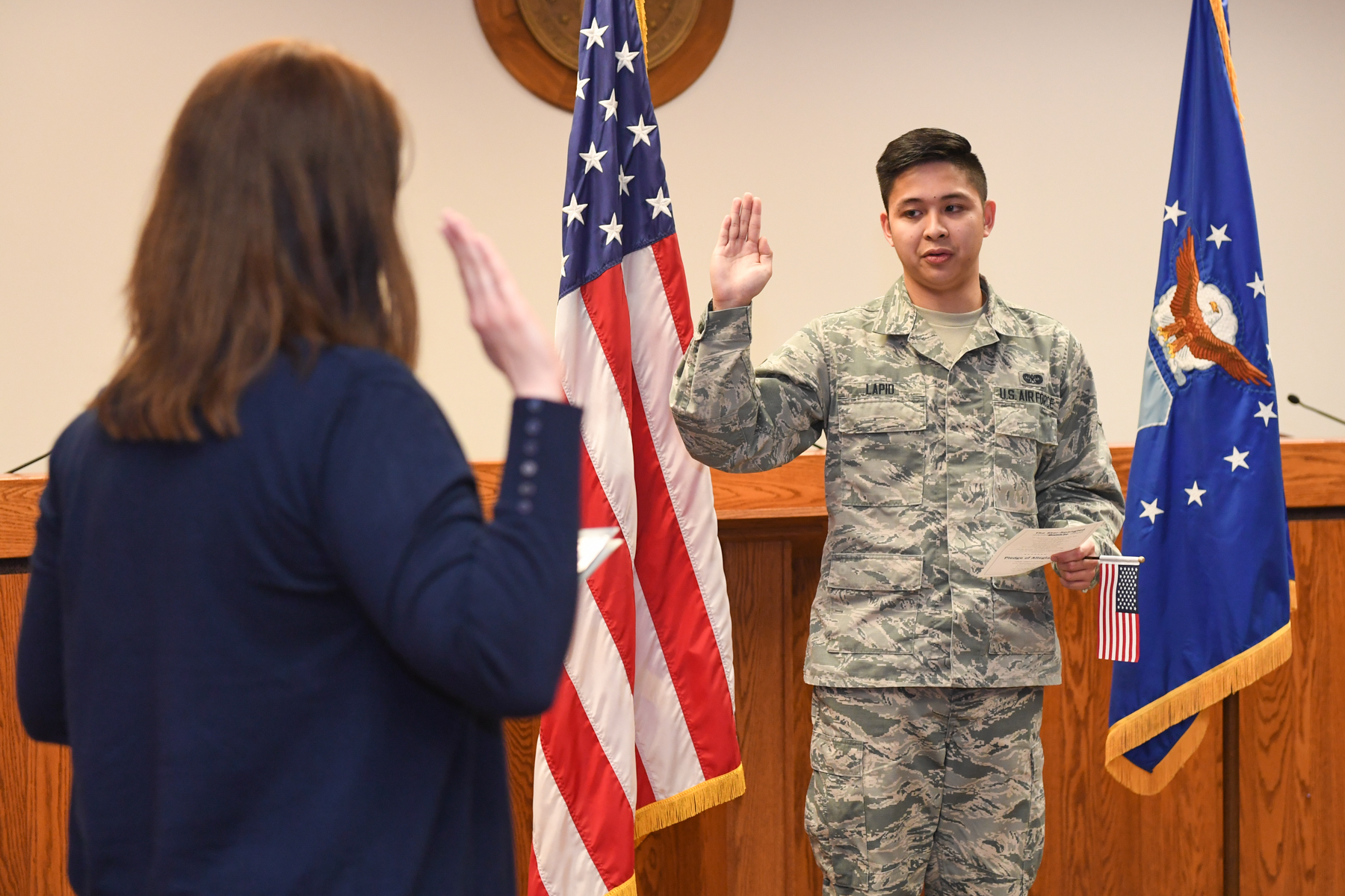 An Airman taking US Citizenship Oath