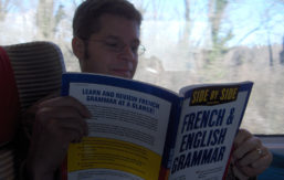 A student learning french from a book
