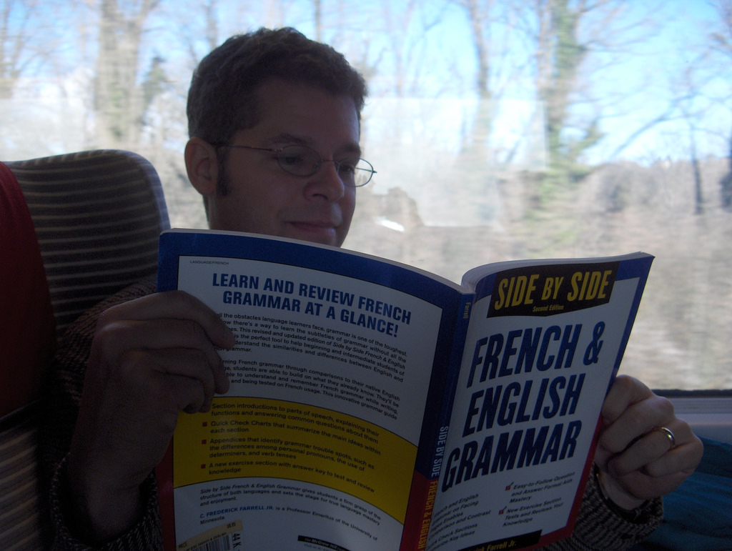 A student learning french from a book